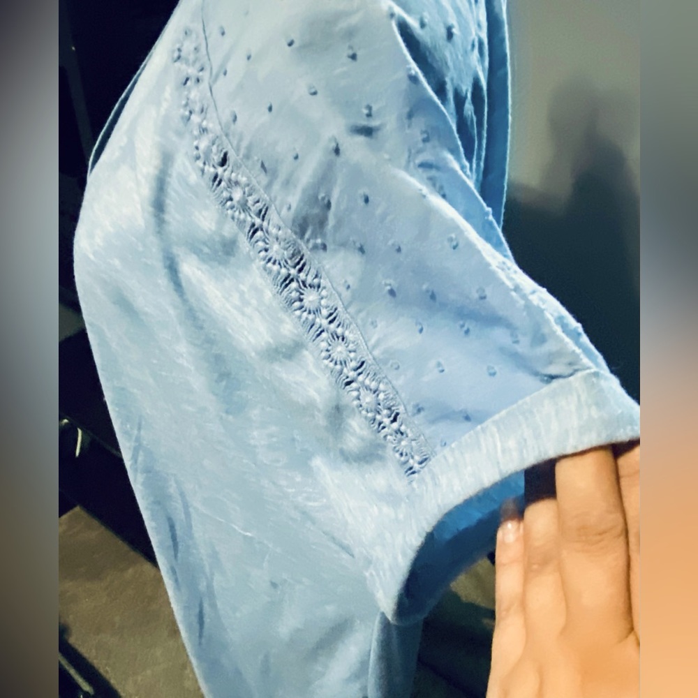 Light Blue colored TShirt blouse. Very cute!